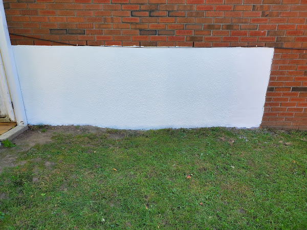 Parge coating on brick wall